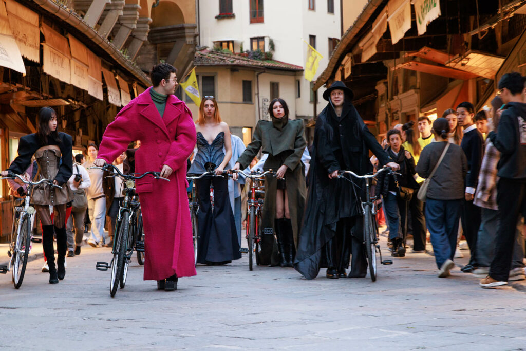 Polimoda Fashion Design students walking on Ponte Vecchio during The 100 Days to the Tour de France event