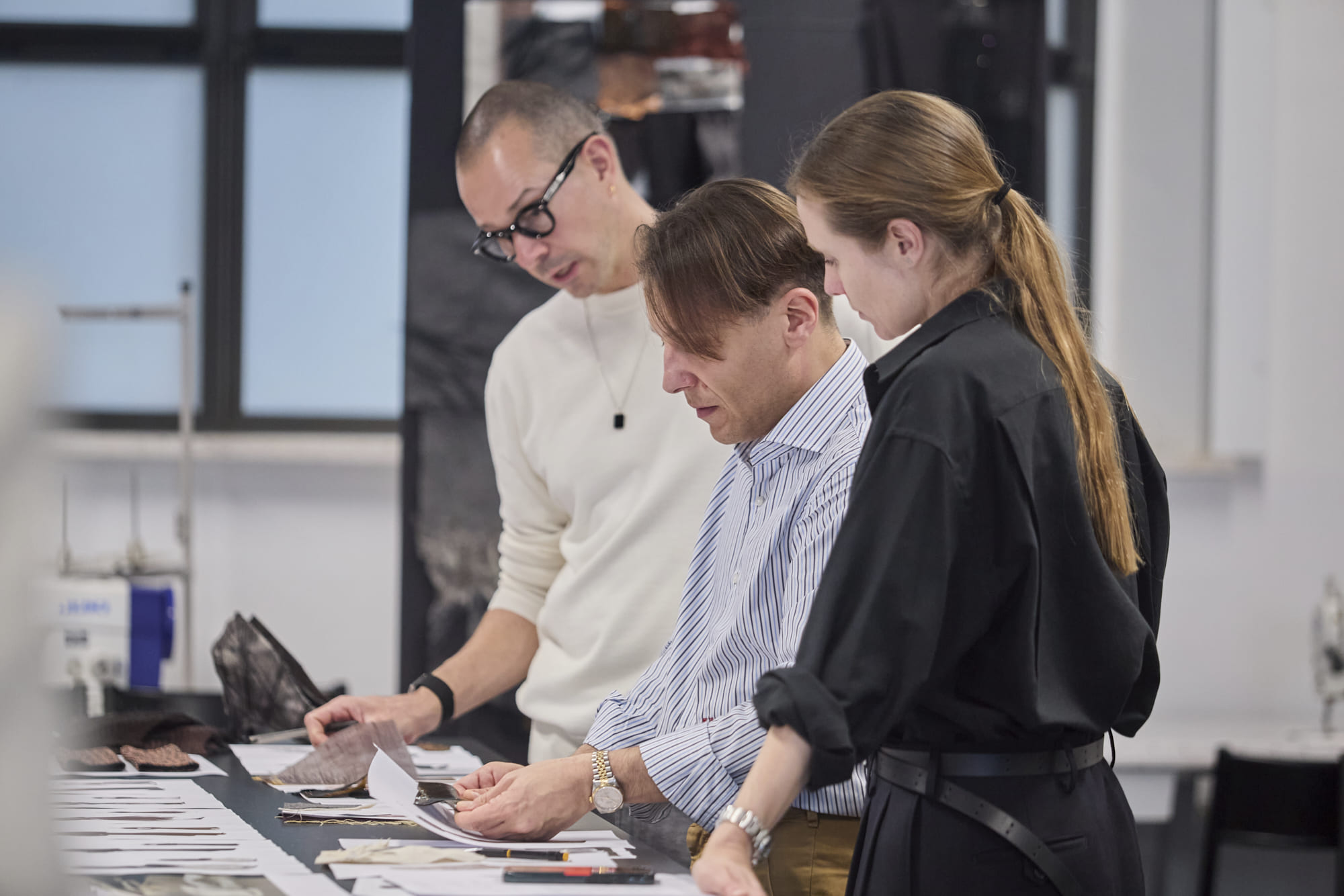 Luigi Giannetta, Luke Meier, and Lucie Meier reviewing Fashion Design student collections at Polimoda’s Manifattura Campus laboratories.