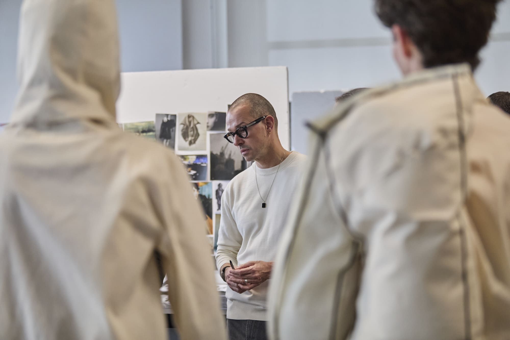 Luke Meier reviewing student garments and collections at Polimoda’s Manifattura Campus laboratories.