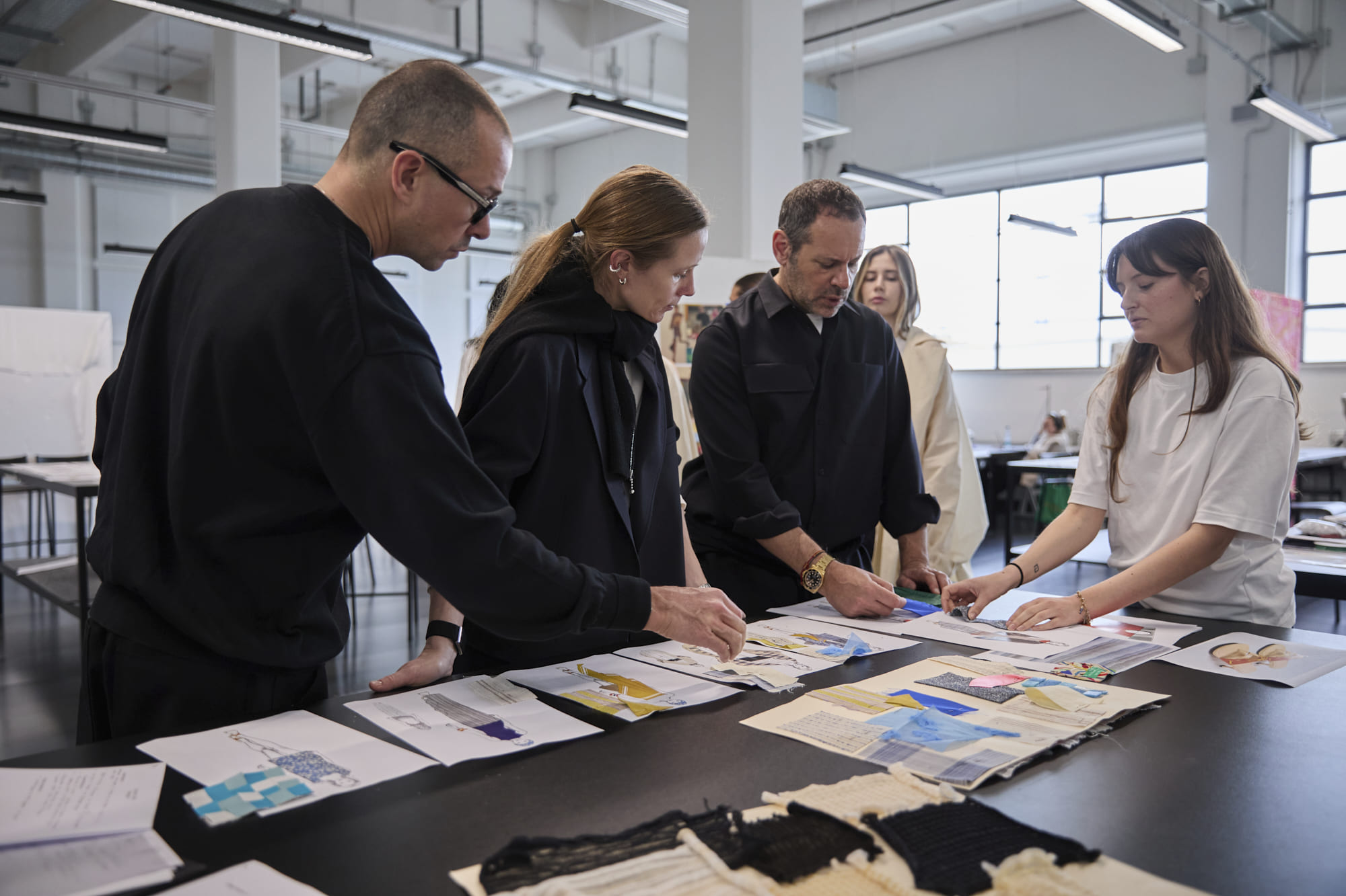 Luke Meier, Lucie Meier, and Massimiliano Giornetti meeting with Polimoda Fashion Design students during collection reviews.